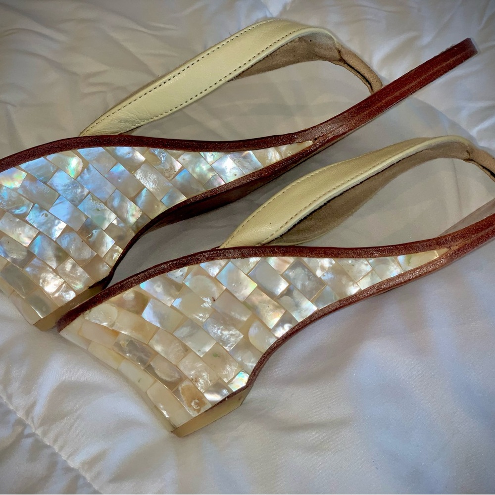 Inlaid mother of pearl on wedge. Leather soles and straps. Impeccable quality!